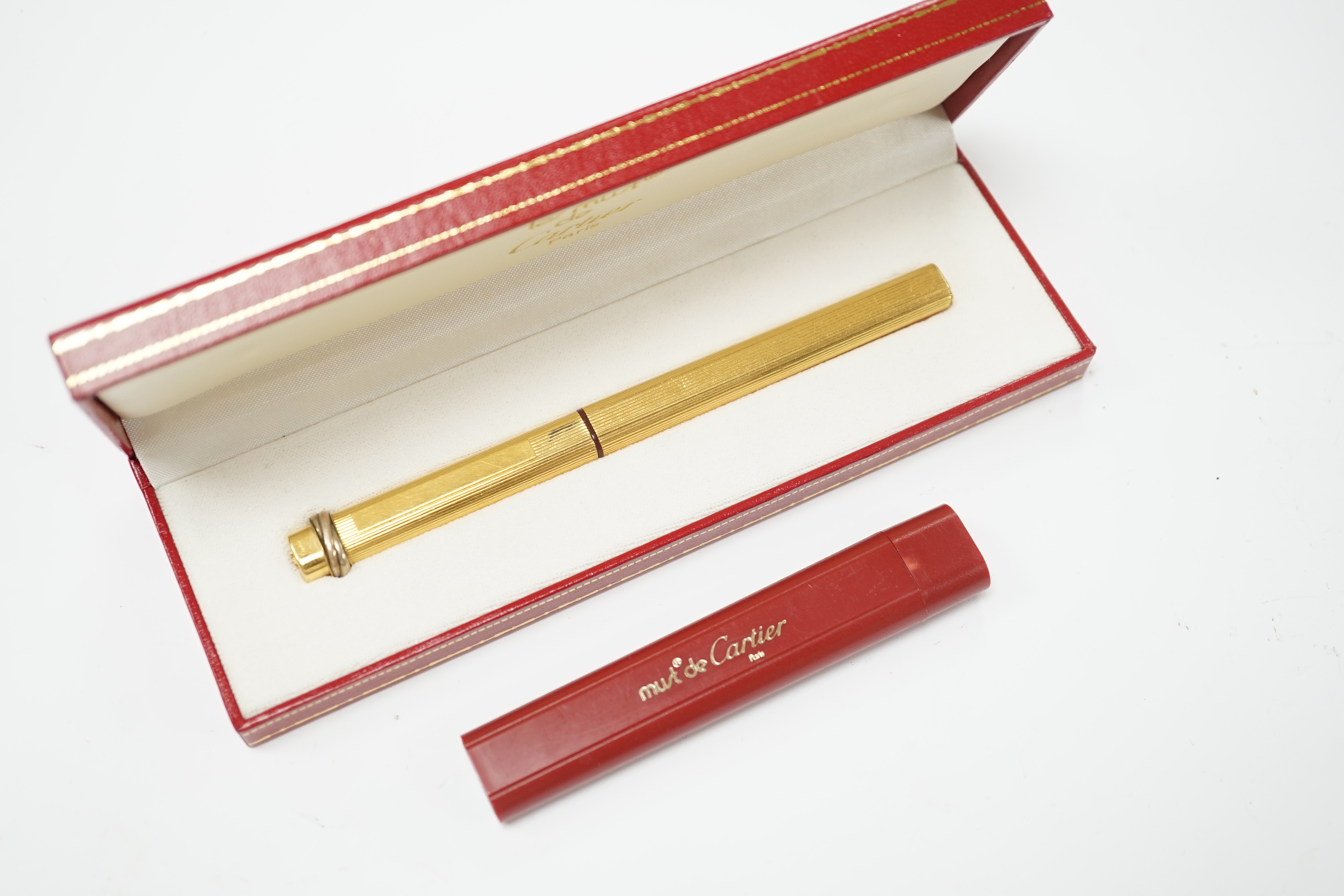 A Les Must De cartier, Vendome Trinity 18k Gold Plated Ballpoint pen with box and refill case